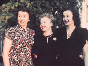 The three daughters of Chester Spencer and Bessie Buzby Spencer. From the left: Betty Spencer, Lois Bryant, and Margaret Spencer. The photo was taken in Seattle in 1948 by their brother, Harry Spencer. Faded color photo of the three daughters of Chester Spencer and Bessie Buzby Spencer. From the left is Betty Spencer, Lois Bryant, and Margaret Spencer.