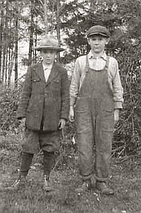 Young brothers Bob and Elton standing outside.
