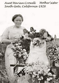 Marian Buzby collecting flowers from the garden in California, 1928.