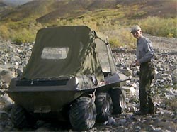 Photo of Harry Elton Buzby (he always liked to be called Elt) and his Hustler, a small 6-wheel vehicle.