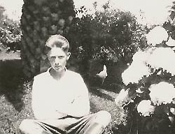 Photo of young Ted Buzby sitting outside